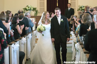 Bride and Groom walking down church aisle